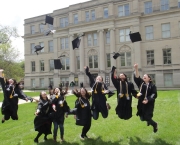 Photo of Graduates jumping outside of Schaeffer hall