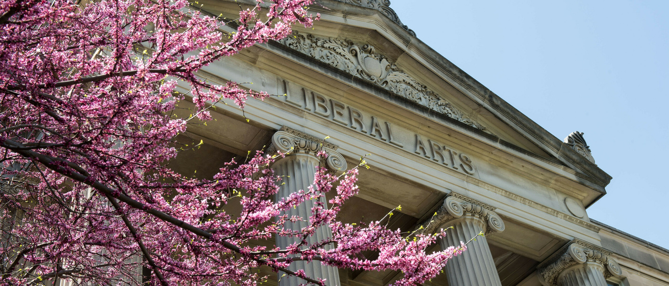 Image of Schaeffer Hall with spring blooms in the foreground